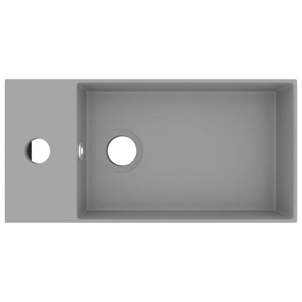 Kylpyhuoneen pesuallas ylivuodolla keraaminen vaaleanharmaa