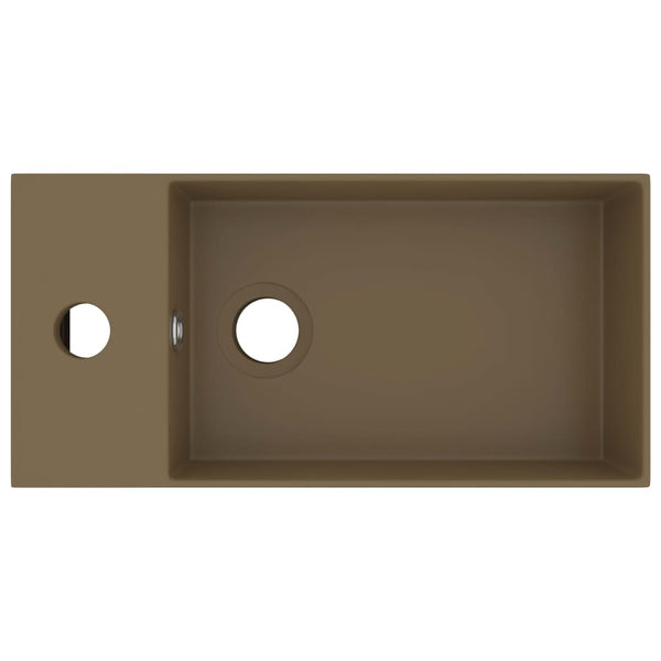 Kylpyhuoneen pesuallas ylivuodolla keraaminen matta kerma