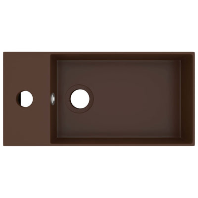 Kylpyhuoneen pesuallas ylivuodolla keraaminen tummanruskea