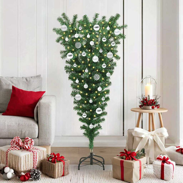 Ylösalasin oleva keinopuumyChristmas-puu, jossa on pallosetti