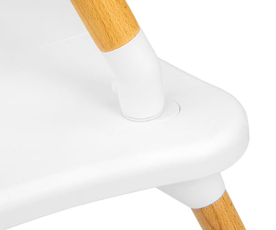 Beige värinen 2-in-1 ruokailutuoli, jossa on valkoinen istuinosa ja pyöreä pöytälevy.