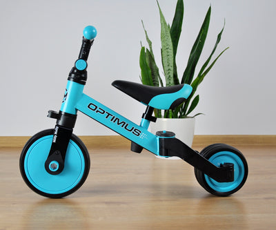 Milly Mally Ride-On Bike 3-in-1 Optimus Blue -kolmipyöräinen lasten ajoneuvo, jossa on siniset ja mustat värit.