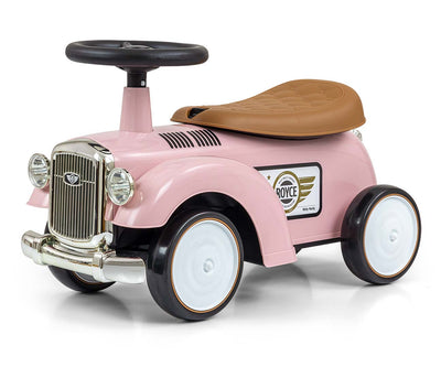 Vaaleanpunainen leikkiauto, jossa on Rolls Royce -logo ja nahkaverhoilu.