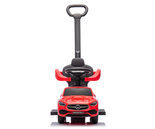 Punainen metallinen lasten ajettava auto rullilla ja työntöaisalla