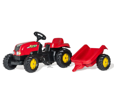 Punainen Rolly Toys -traktori lapsille, jossa on perävaunu.