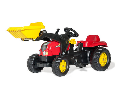 Punainen Rolly Toys -traktori lapsille, jossa on kauha ja perävaunu.