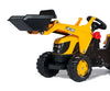 Rolly Toys -merkkinen traktori, jossa on JCB-logo. Traktorissa on kauha ja peräkärry.