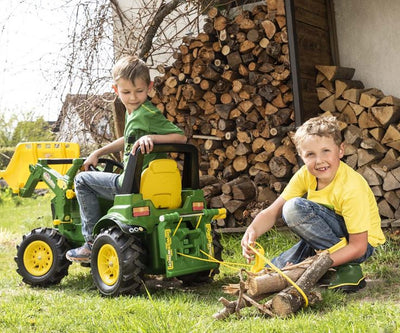Vihreä Rolly Toys -merkkinen vetolelu, jossa on kääntyvä kahva ja narut.