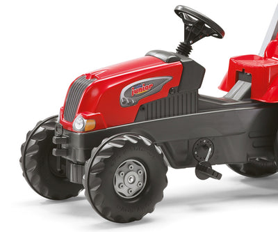 Punainen Rolly Toys -traktori Rolly Junior RT, jossa perävaunu.
