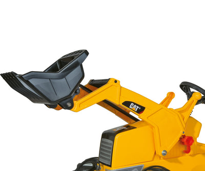 Rolly Toys -merkkinen traktori leikkikärryllä ja lapiona.