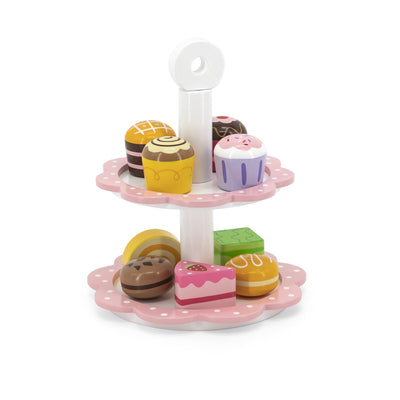Kuvassa on Viga 44544 -merkkinen jälkiruokasetti, joka sisältää tarjoilualustan ja neljä desserttilautasta eri väreissä. Tarjoilualustassa on reikä keskellä, johon desserttilautaset voi asetella näyttävästi.
