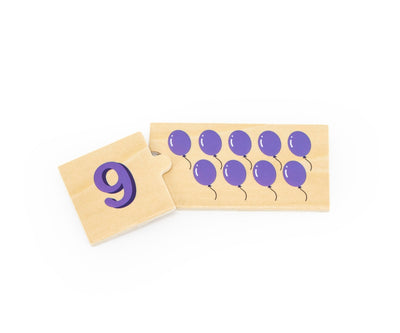 Puzzle-paketti, jossa on numeroidut palat ja kuvioita, kuten hedelmiä ja eläimiä.