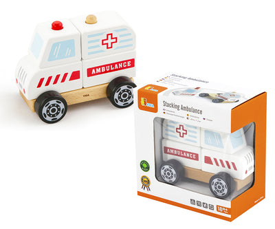 Puinen ambulanssiauto lasten rakennuspalikoiden joukossa.