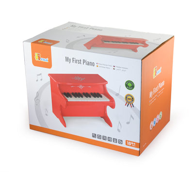 Punainen ensimmäinen pianolelu lapselle.